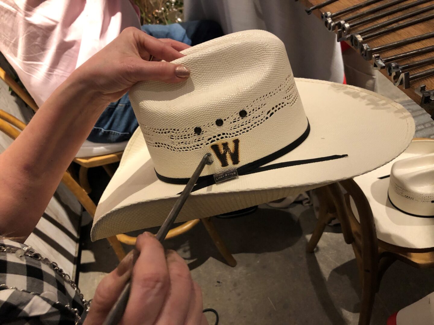 A hat branded with the alphabetical letter W